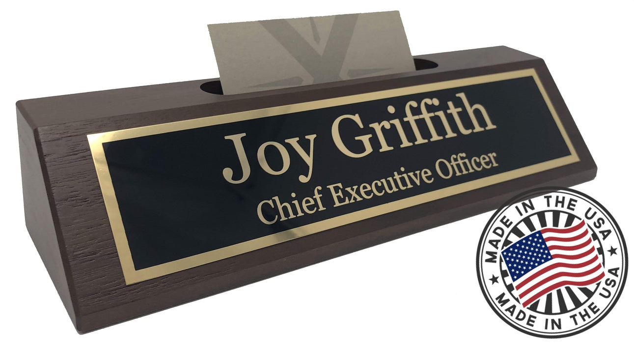 Close up of walnut finish desk name plate with a white business card in center slot.