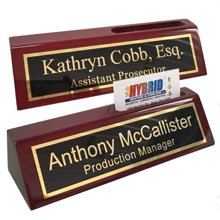 Photo of two wood desk name plates that have been custom engraved.