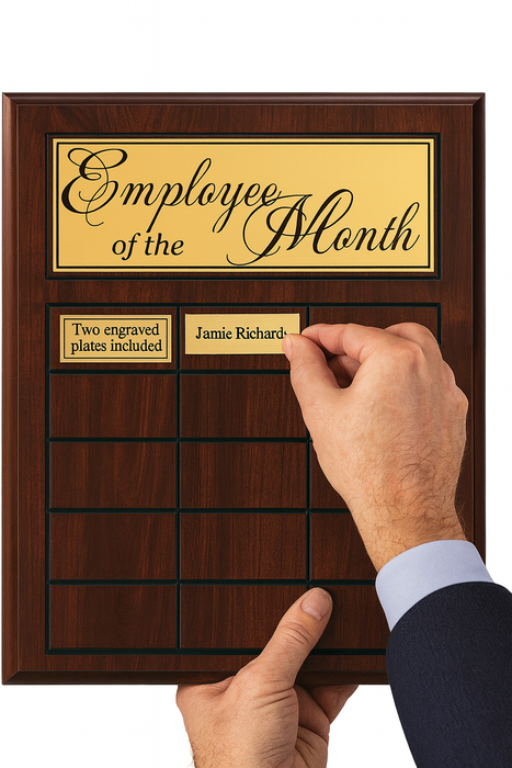Employee of the month plate being added to perpetual plaque award.