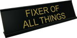 Fixer of all things desk sign show in in black with flat gold.