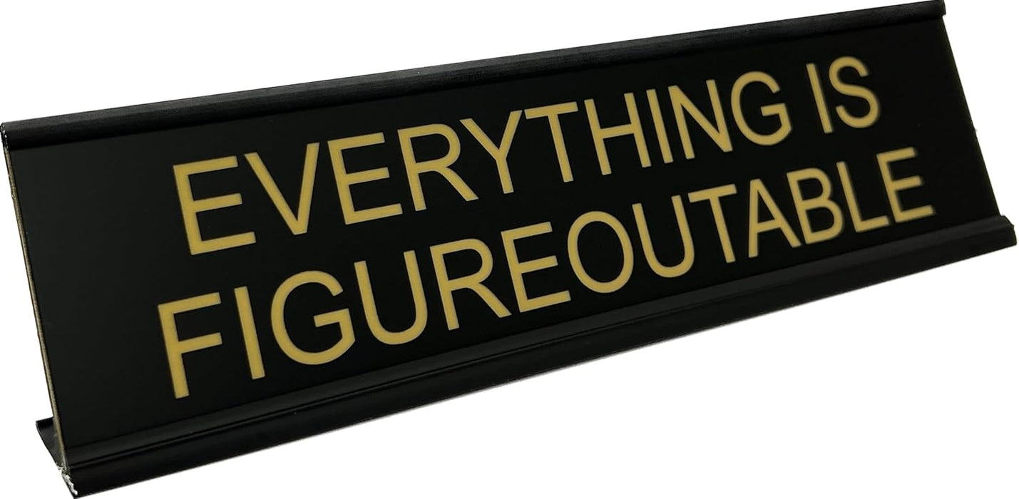 Shown in black with flat gold text. Funny desk name plate and office decor.