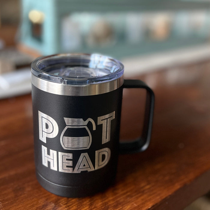 Pot Head 15 ounce Stainless Steel Insulated Coffee Mug on dining table.